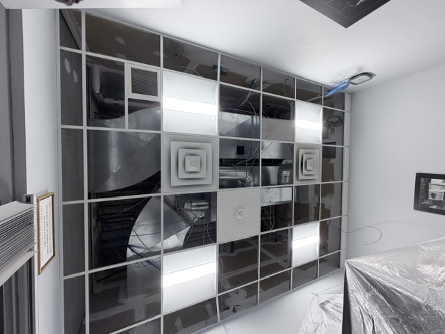 Exposed ceiling grid and mechanical systems before finishing